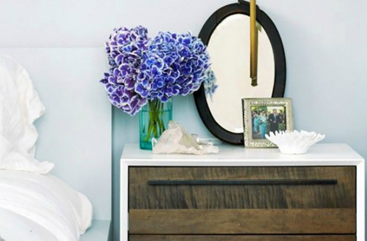 Night stand with mirror and flowers