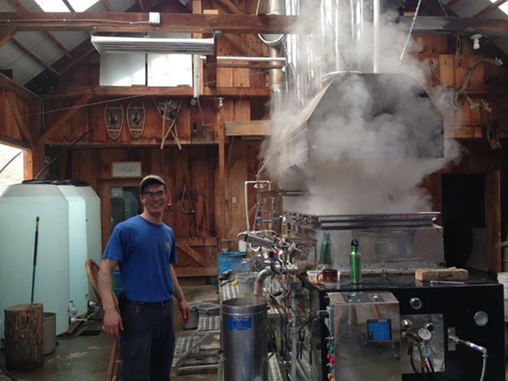 David’s farm hand Jonathan working at the evaporator.