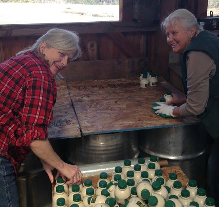 Judy and her sister Rachel sorting half pints.