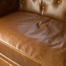 signs of stretching in top-grain, full-aniline-dyed leather