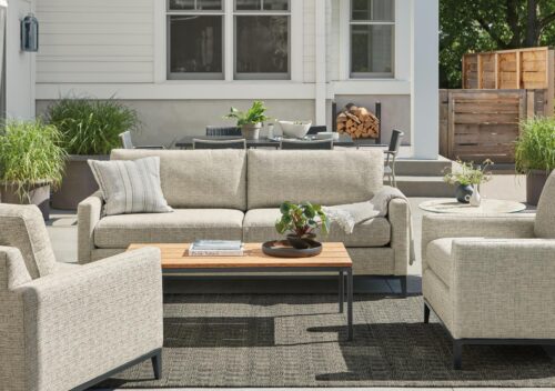 Tomas outdoor sofa and two chairs in Phipps taupe fabric with Parsons 48-wide coffee table in graphite with Bamboo top.