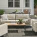 Tomas outdoor sofa and two chairs in Phipps taupe fabric with Parsons 48-wide coffee table in graphite with Bamboo top.
