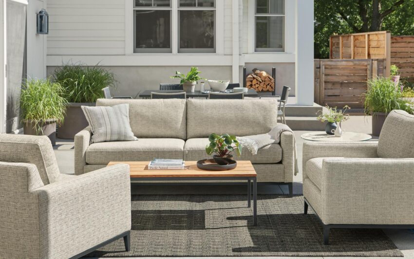 Tomas outdoor sofa and two chairs in Phipps taupe fabric with Parsons 48-wide coffee table in graphite with Bamboo top.