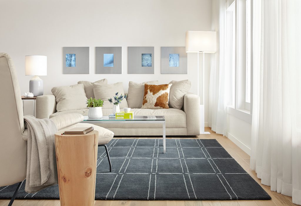 Bridge rug with cowhide pillow and Reclaimed Wood stool