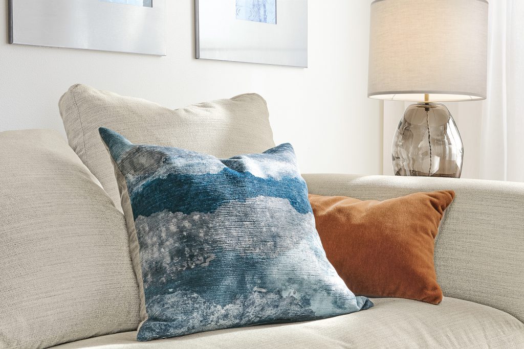 Storm accent pillow on sofa
