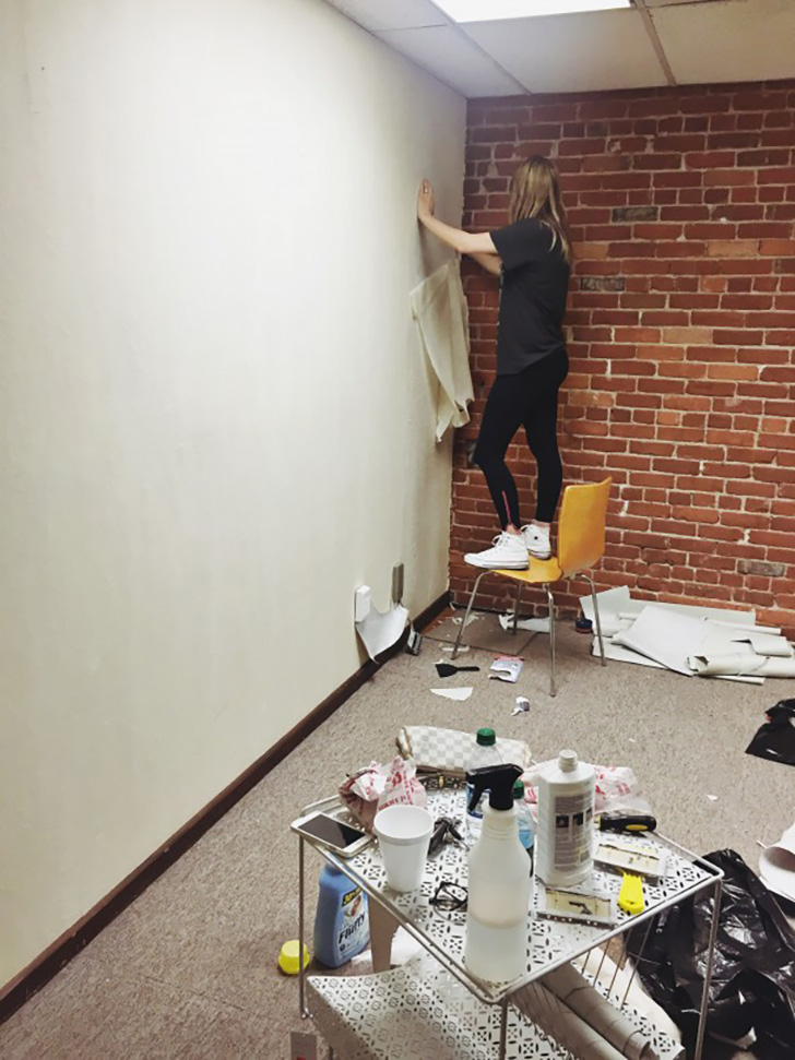 Kirsten hard at work removing wallpaper