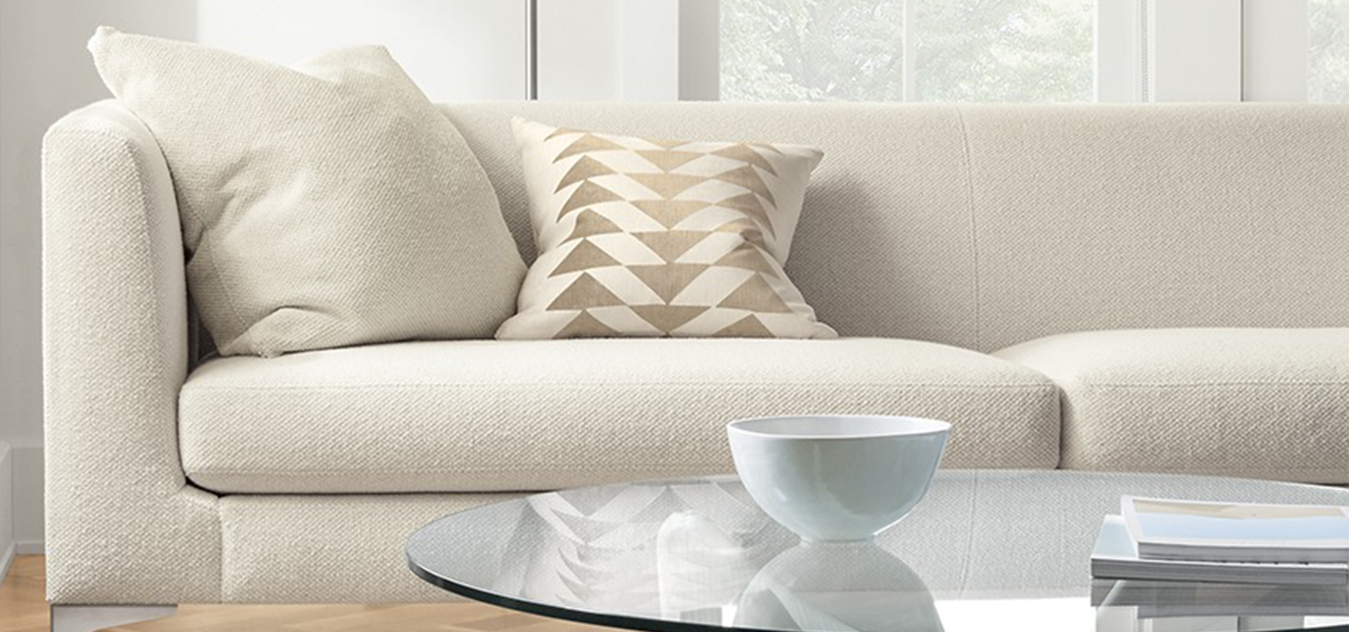 Ivory sofa with accent pillows