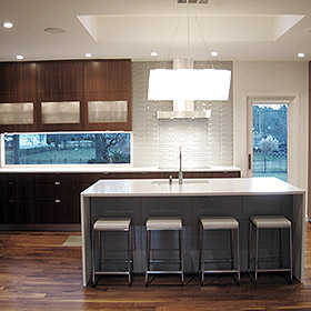 Kitchen with white Collins bar stools