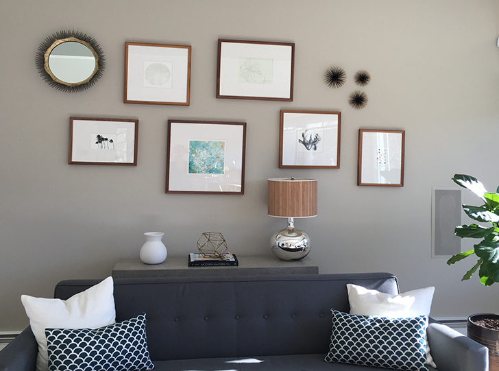 Profile wall frames over sofa