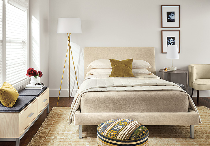 Modern bedroom with Ella upholstered bed, Tri-plex floor lamp with gold base and ceramic Capstone table lamp
