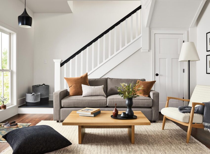 room setting including york 87-wide sofa in dawson cement, callan chair, corbett coffee table, dia rug.