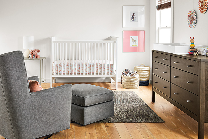 Baby room with kids furniture six-drawer dresser and modern rocker glider