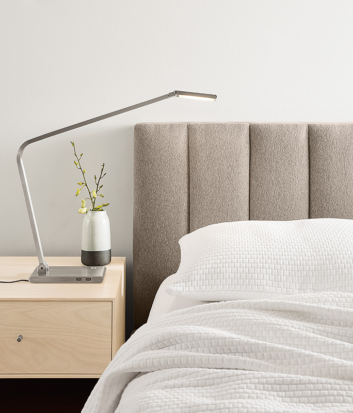 White matelasse coverlet and upholstered Hartley bed