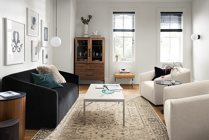 black modern sofa in white living room