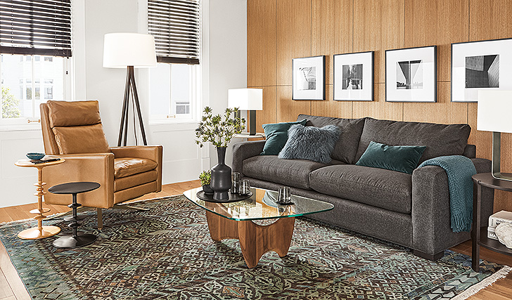 gray fabric sofa in living room beside leather recliner