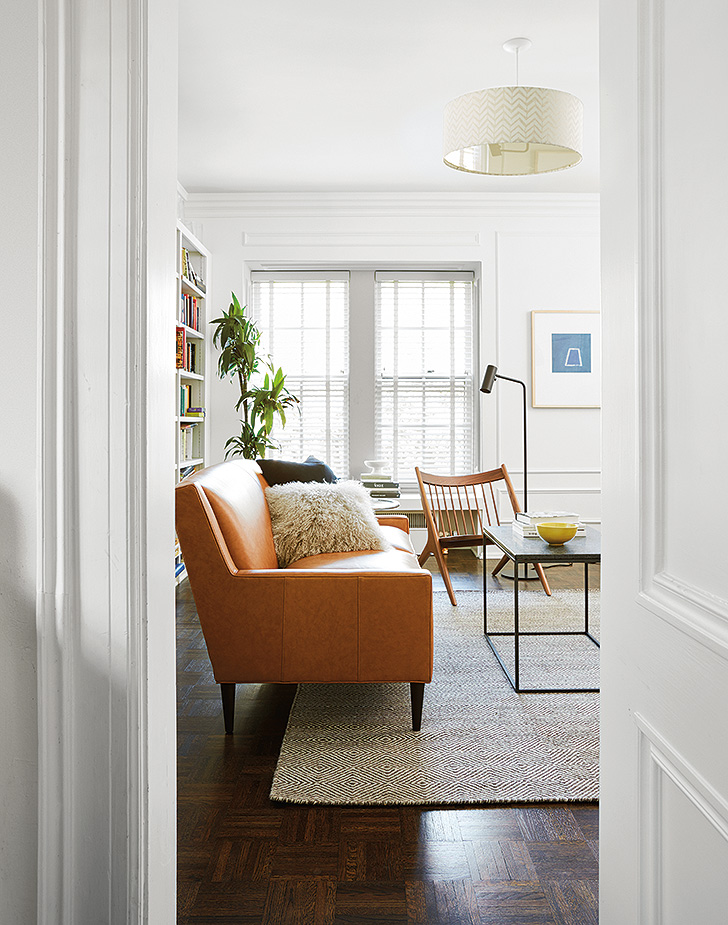 Braden leather sofa in a TV and lounge room with Tibetan sheepskin pillow