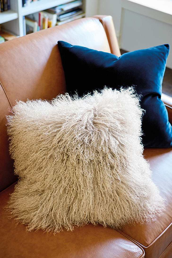 Close-up of Tibetan sheepskin throw pillow and Mohair throw pillow