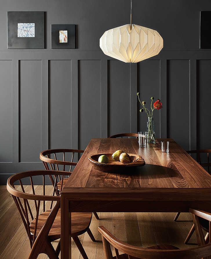 Walsh dining table illuminated by Orikata linen pendants