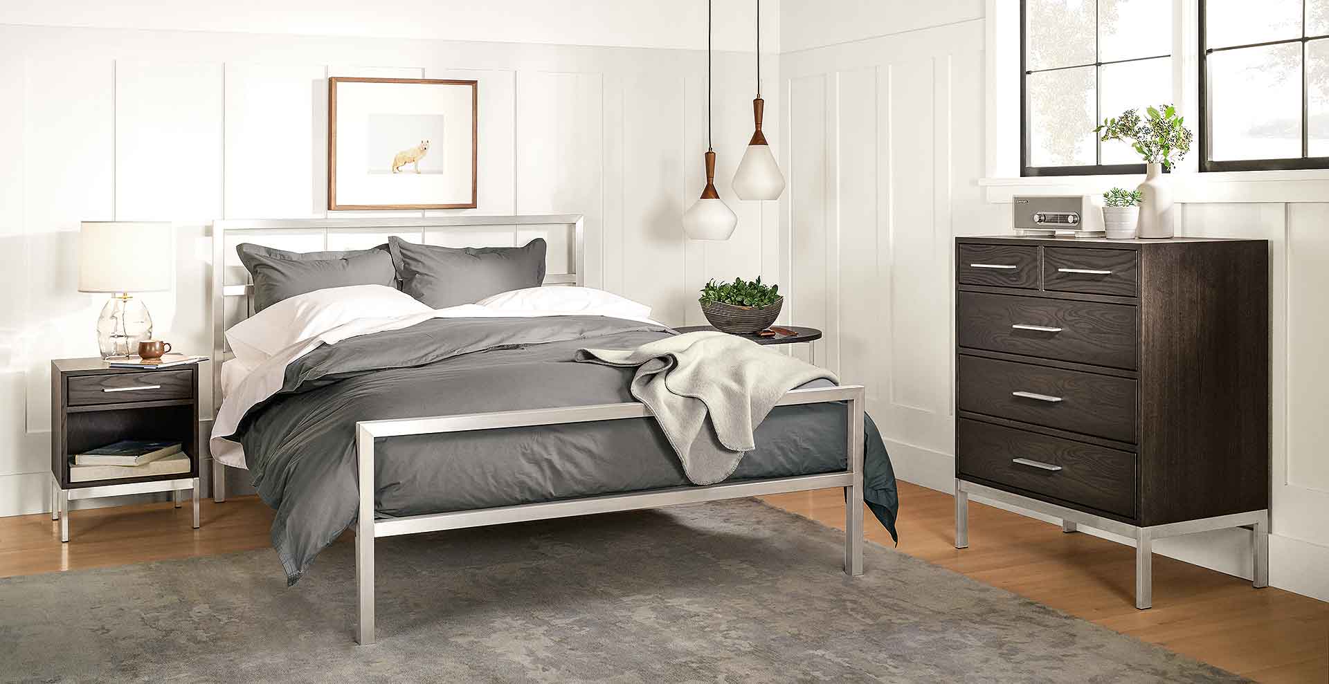 Plug-in pendant lights accent a contemporary bedroom.