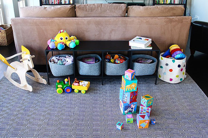 Functional kids play area with book and toy storage