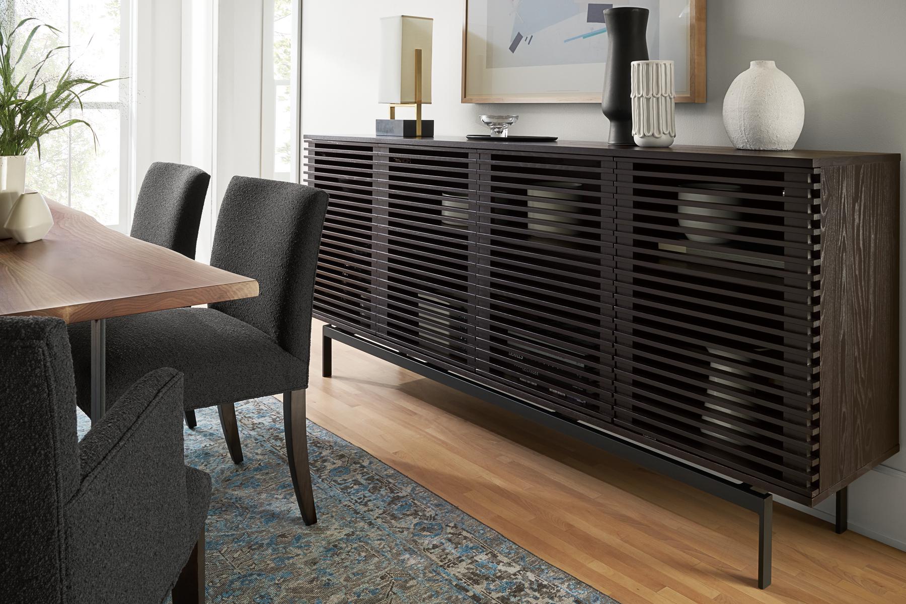 large black coles media cabinet in dining area.