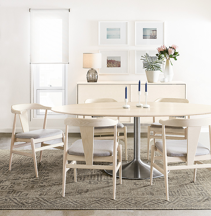 Scandinavian-inspired wood Evan dining chairs with fabric seats