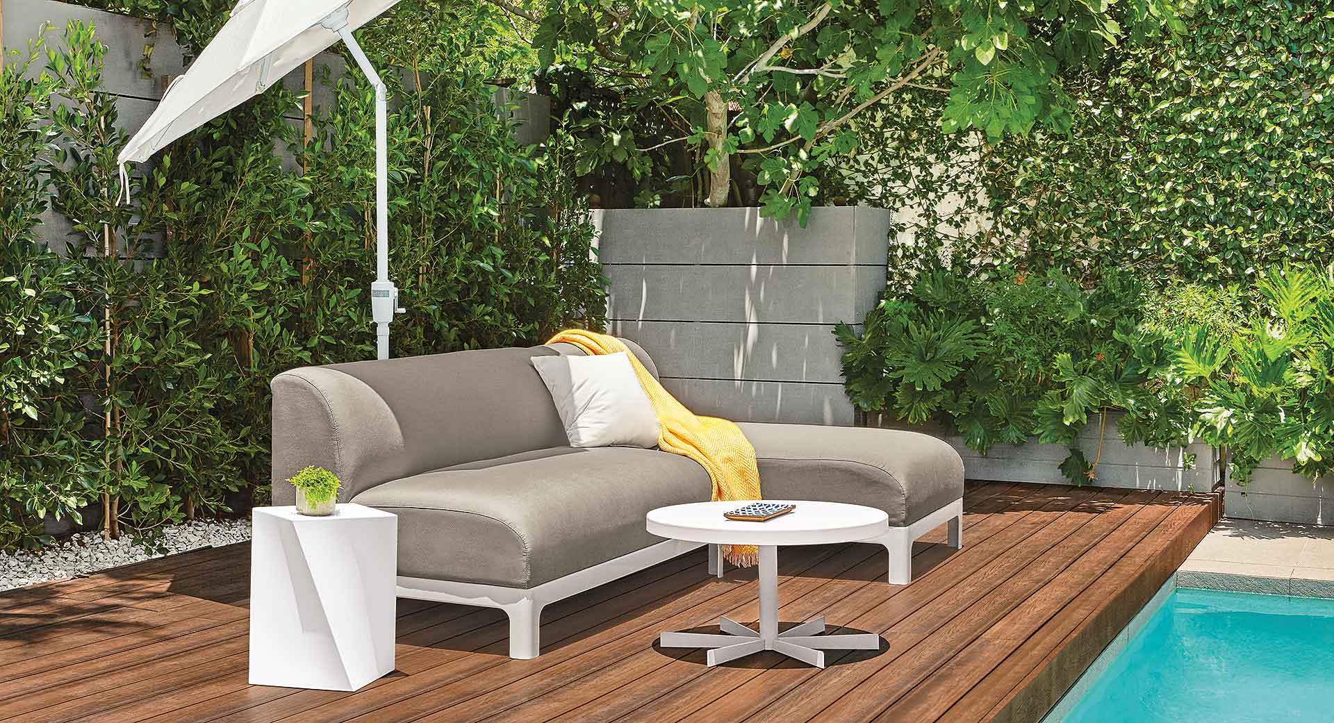 Crescent outdoor sofa/chaise with Gehry cube end table
