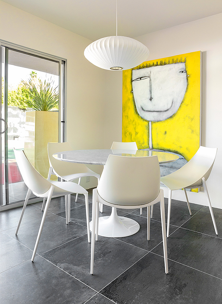 Modern dining room with white dining chairs