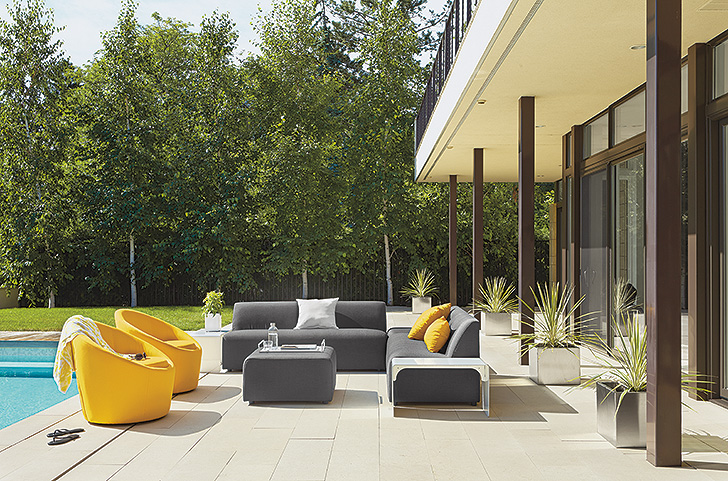 Outdoor living space with Laguna outdoor sofas and Crest swivel chairs