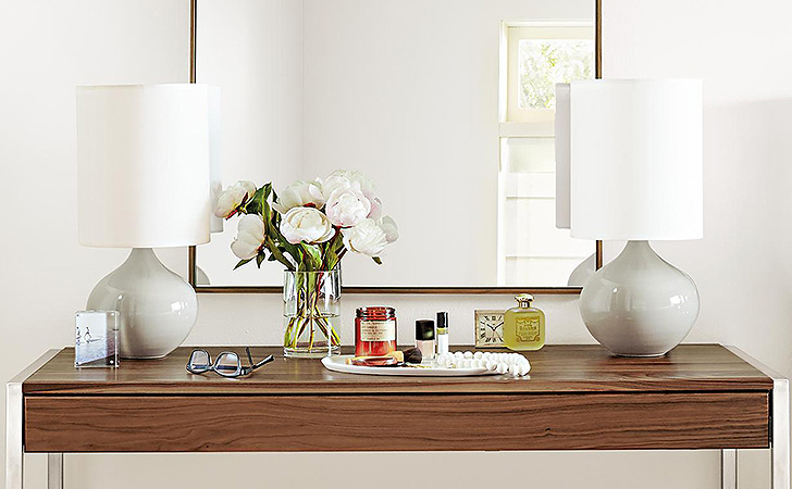 Serena ceramic lamps flank an entryway table.