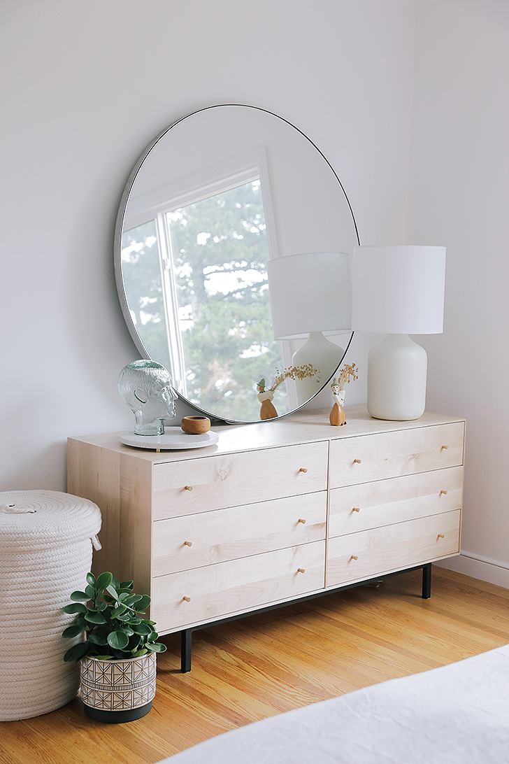 Modern wood dresser with round mirror