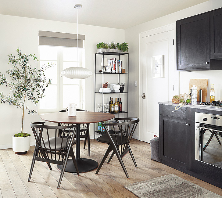 Modern small space kitchen with Aria round dining table and Soren wood chairs