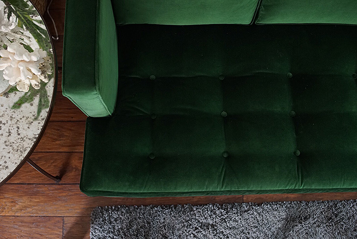 Closeup of green velvet sofa