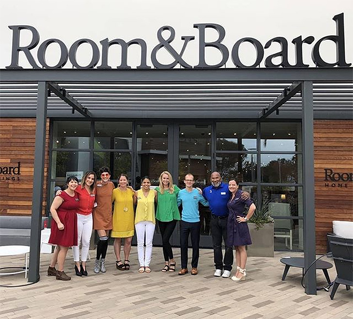 Staff members at Room & Board San Diego celebrate pride in rainbow shirts.