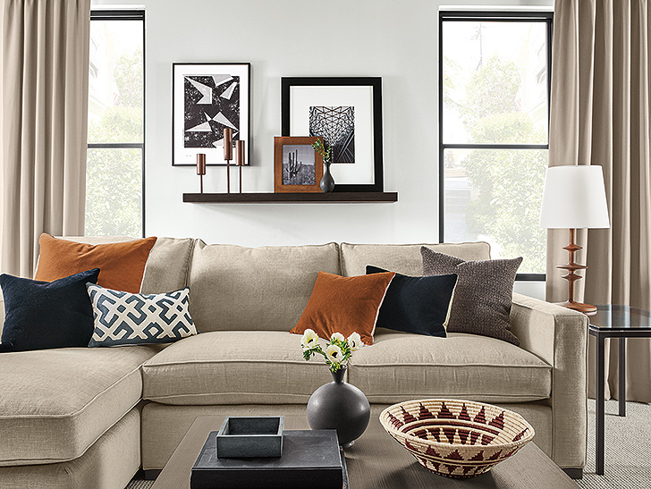 Float wall shelf and ledge displaying photo frames and candlesticks