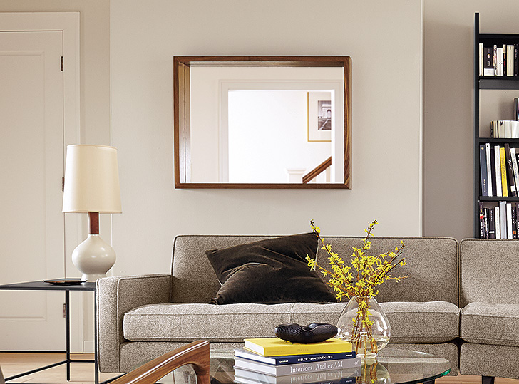 Modern living room with large wooden-framed wall Loft mirror