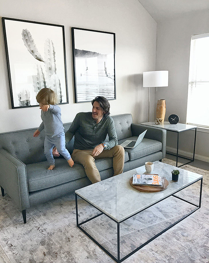 Dad and son on grey sofa