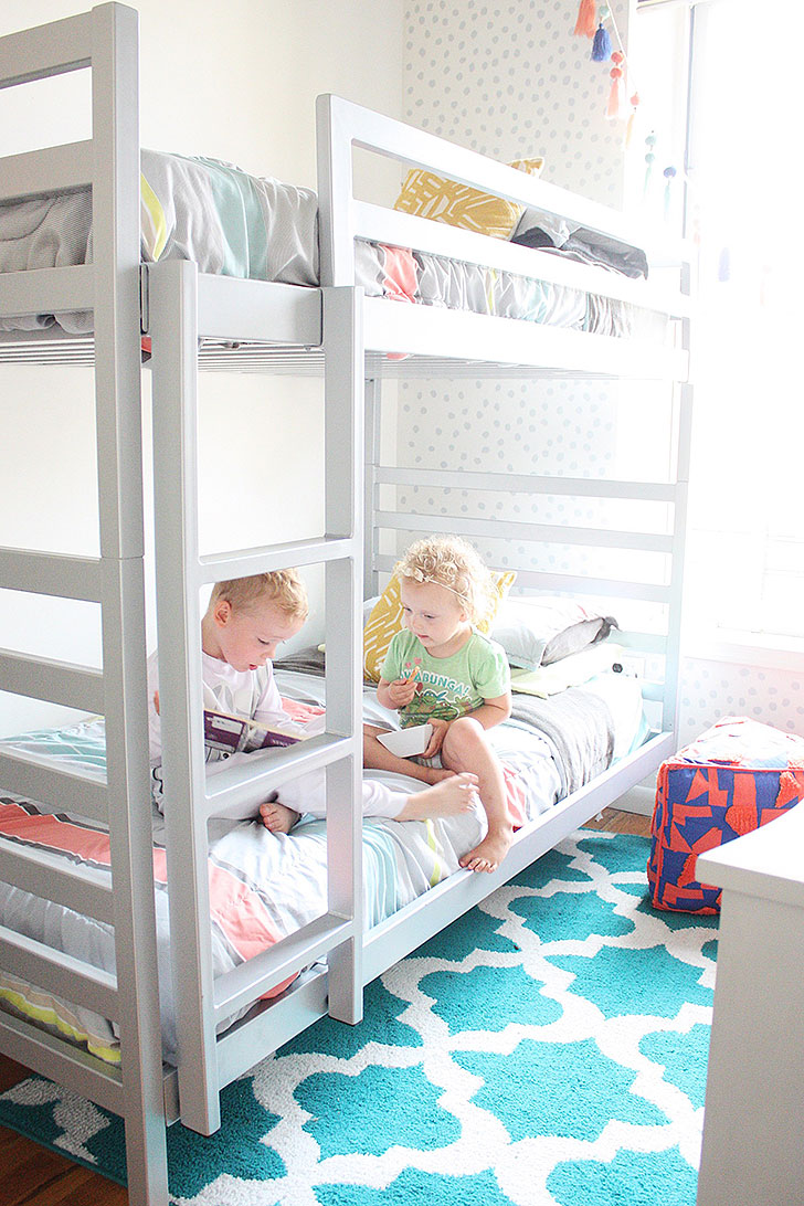 Bright kids room with white bunk bed