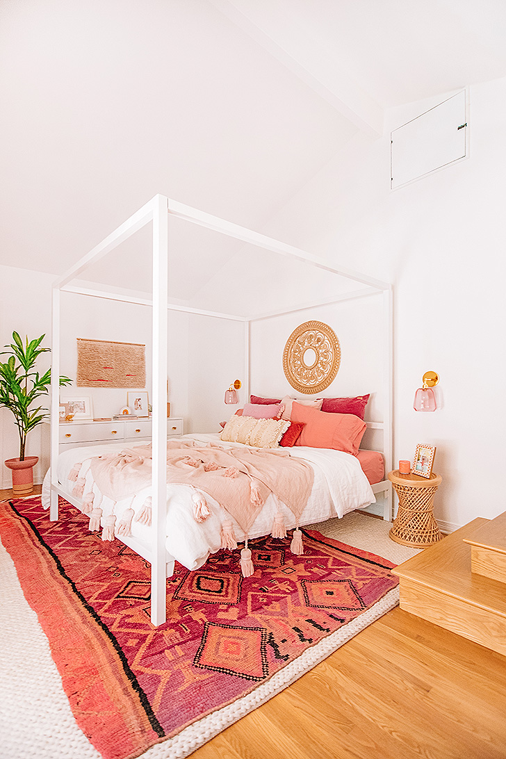 Colorful master bedroom with white canopy bed