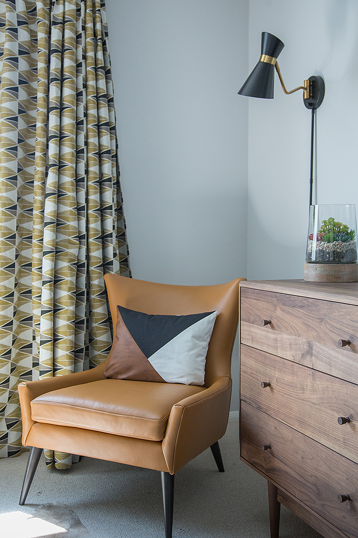 Leather accent chair in bedroom corner