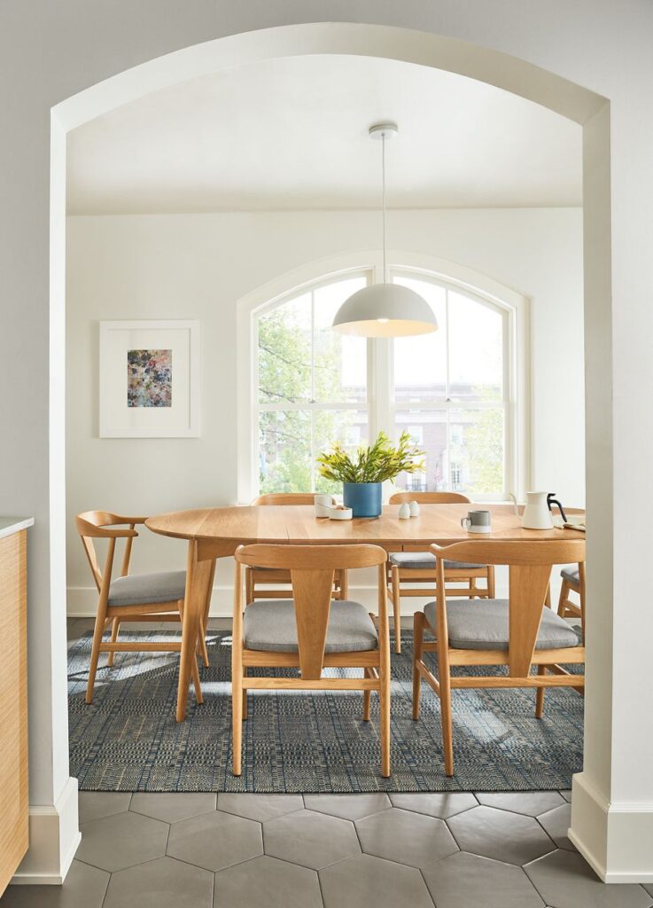 Detail of Ventura round extension table in white oak.