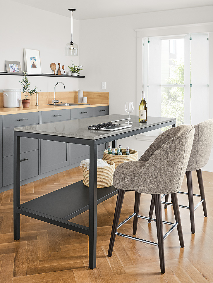 upholstered stools at counter table in kitchen