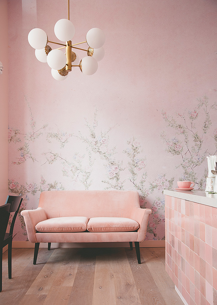 Pink velvet sofa inside Sweet Laurel Bakery