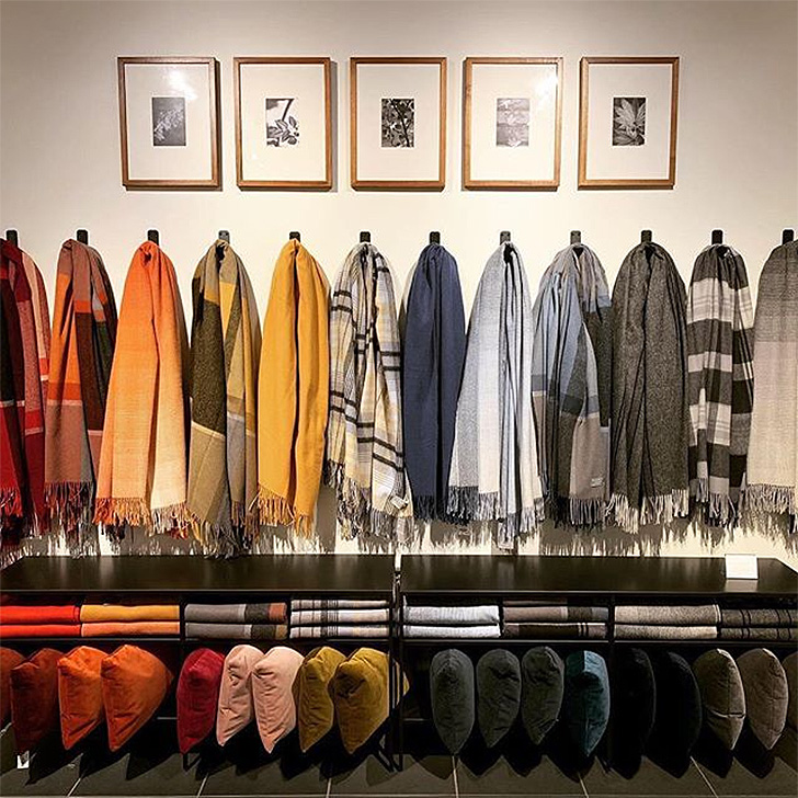 Throw blankets displayed in a rainbow