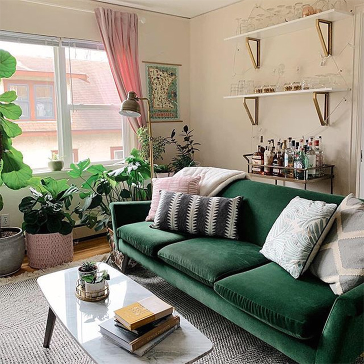 Living room with green velvet sofa
