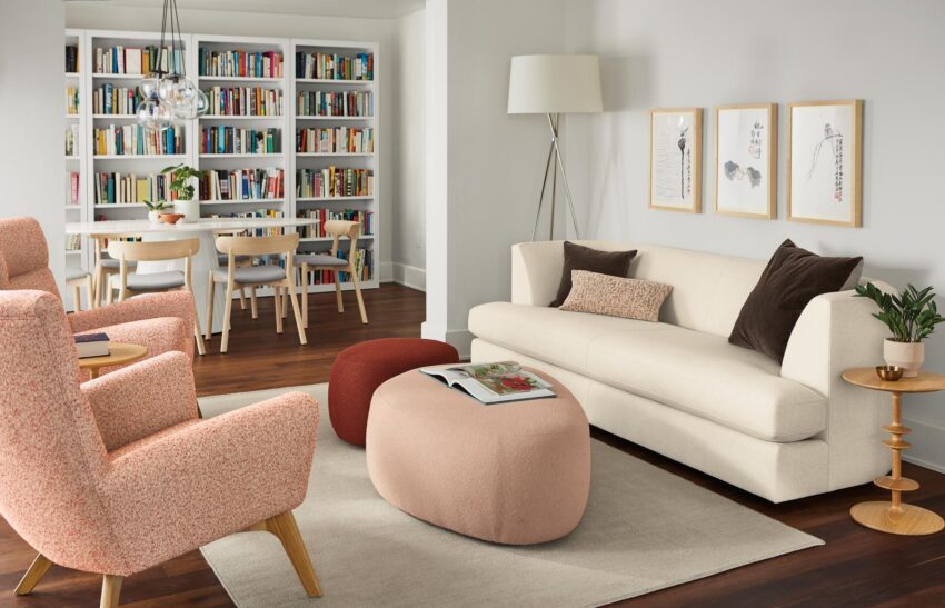 room setting with astaire sofa in sumner ivory, asher ottomans and boden chairs.