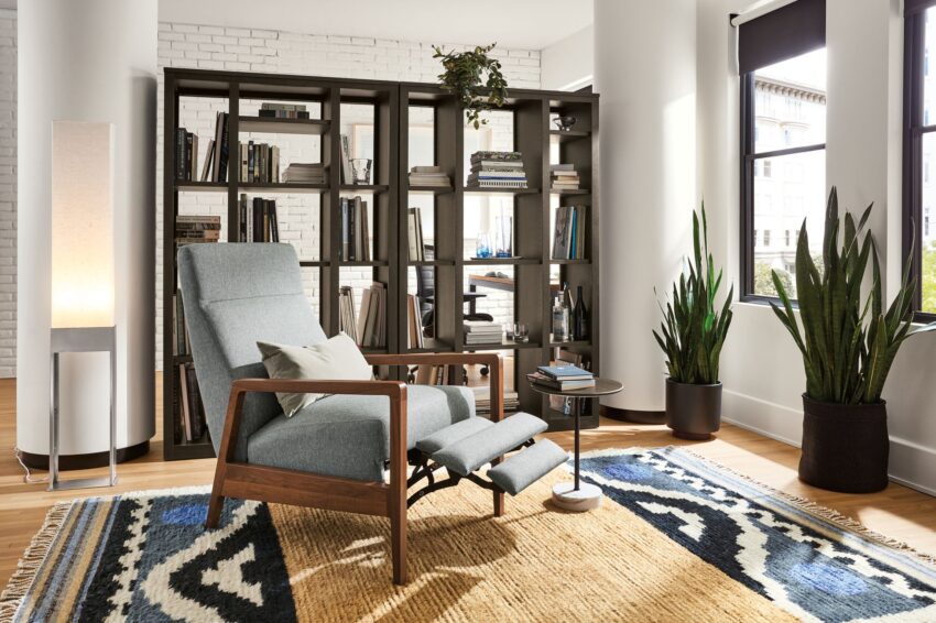 room setting including westport recliner, woodwind bookcases, parsons table and finora office chair.