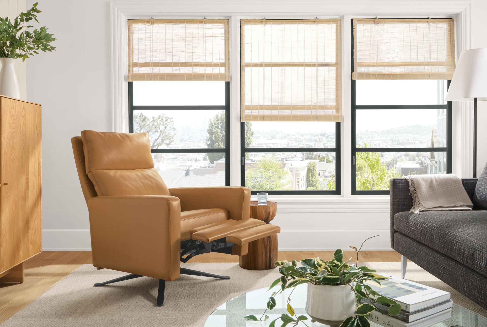 Detail of Wynton Select recliner in Lecco Camel leather with footrest extended in living room.