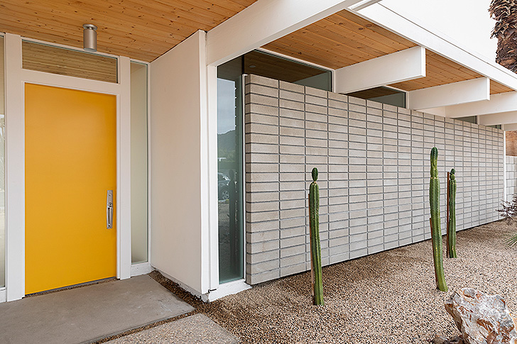 Exterior shot of the Desert Eichler home with yellow door