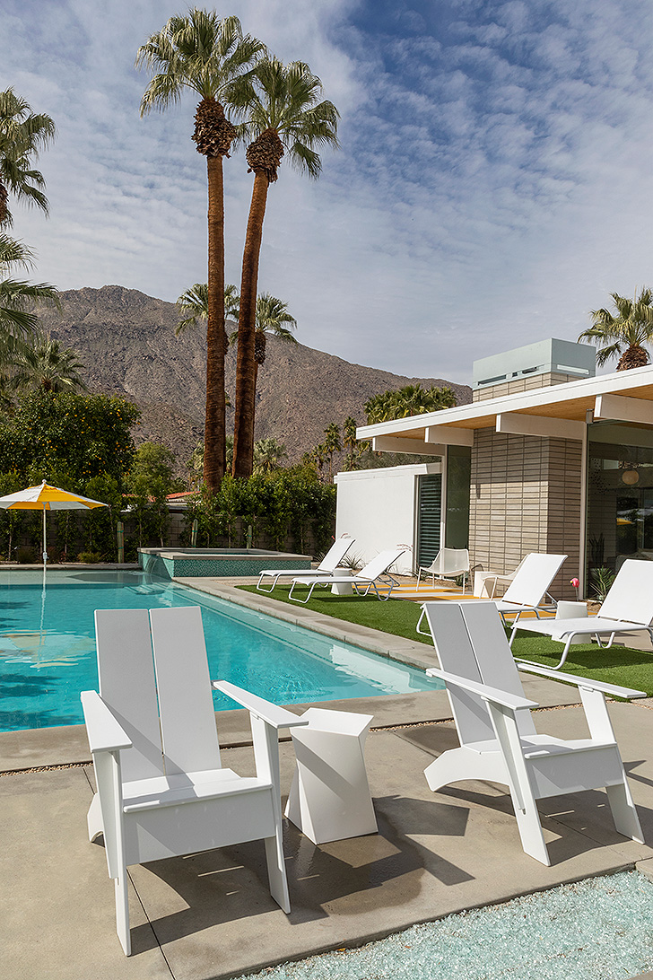 Backyard with pool and lounge chairs, overlooking the mountains 